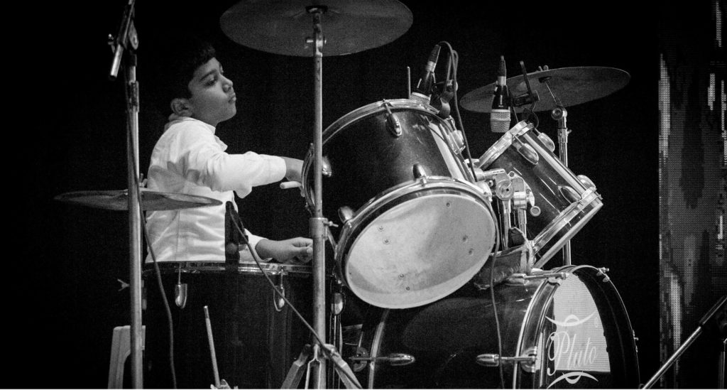 Kid playing drums